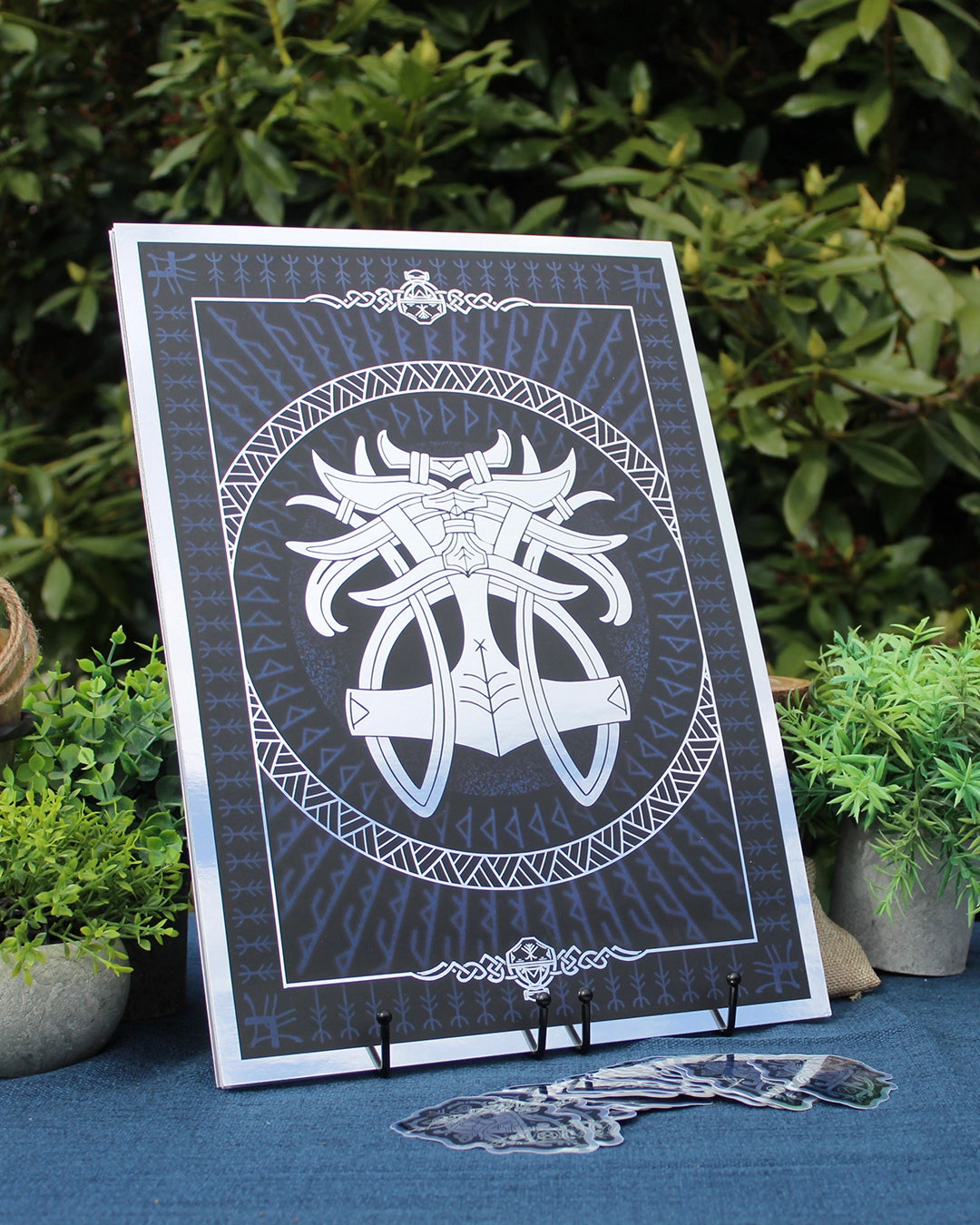 Silver foil A3 print godmask of Norse god Thor with Viking ornamentation and runic detail.