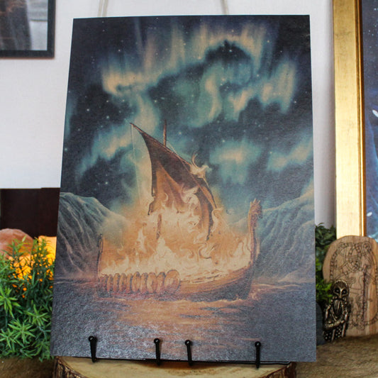 A3 art print of Viking funeral with burning ship on the water inspired by Norse myth, printed on recycled brown paper for a rustic finish.