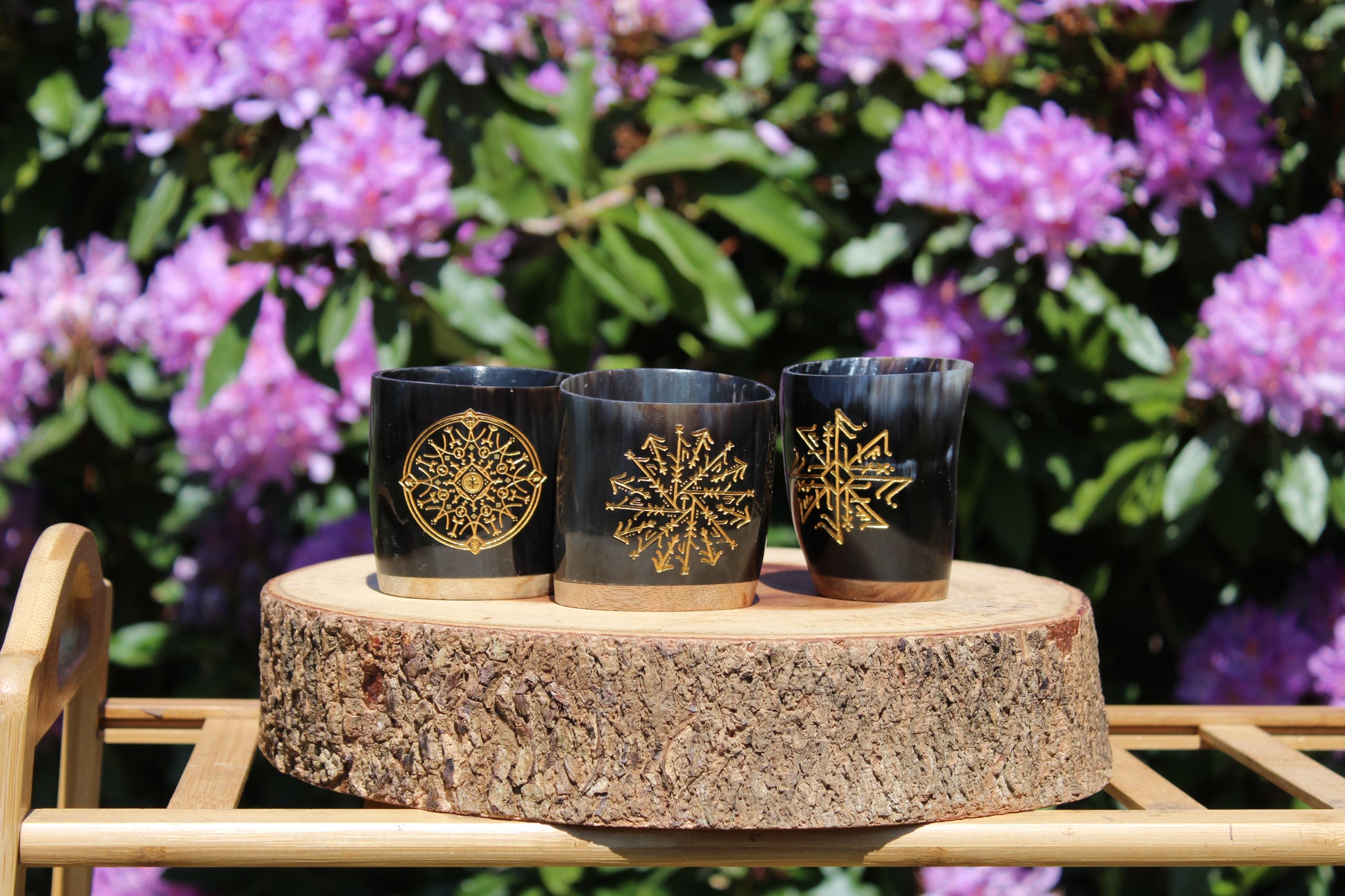 Handcrafted Viking horn shot glasses with natural polished finish, Norse drinkware for mead and whiskey.