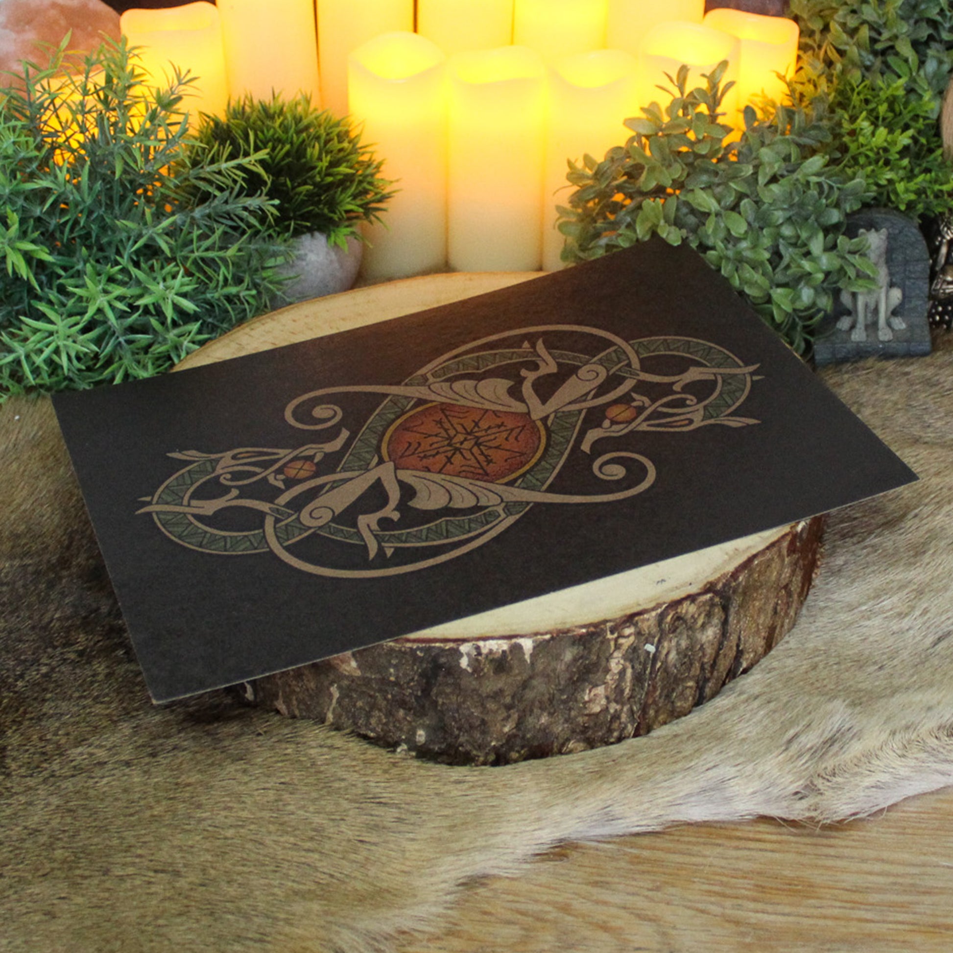 A4 print with a stunning depiction of the celestial wolves, Sköll and Hati, two great figures of Norse myth. This print captures their eternal pursuit in a striking, interwoven traditional Viking knotwork design. Created by Jonas Lau Markussen.