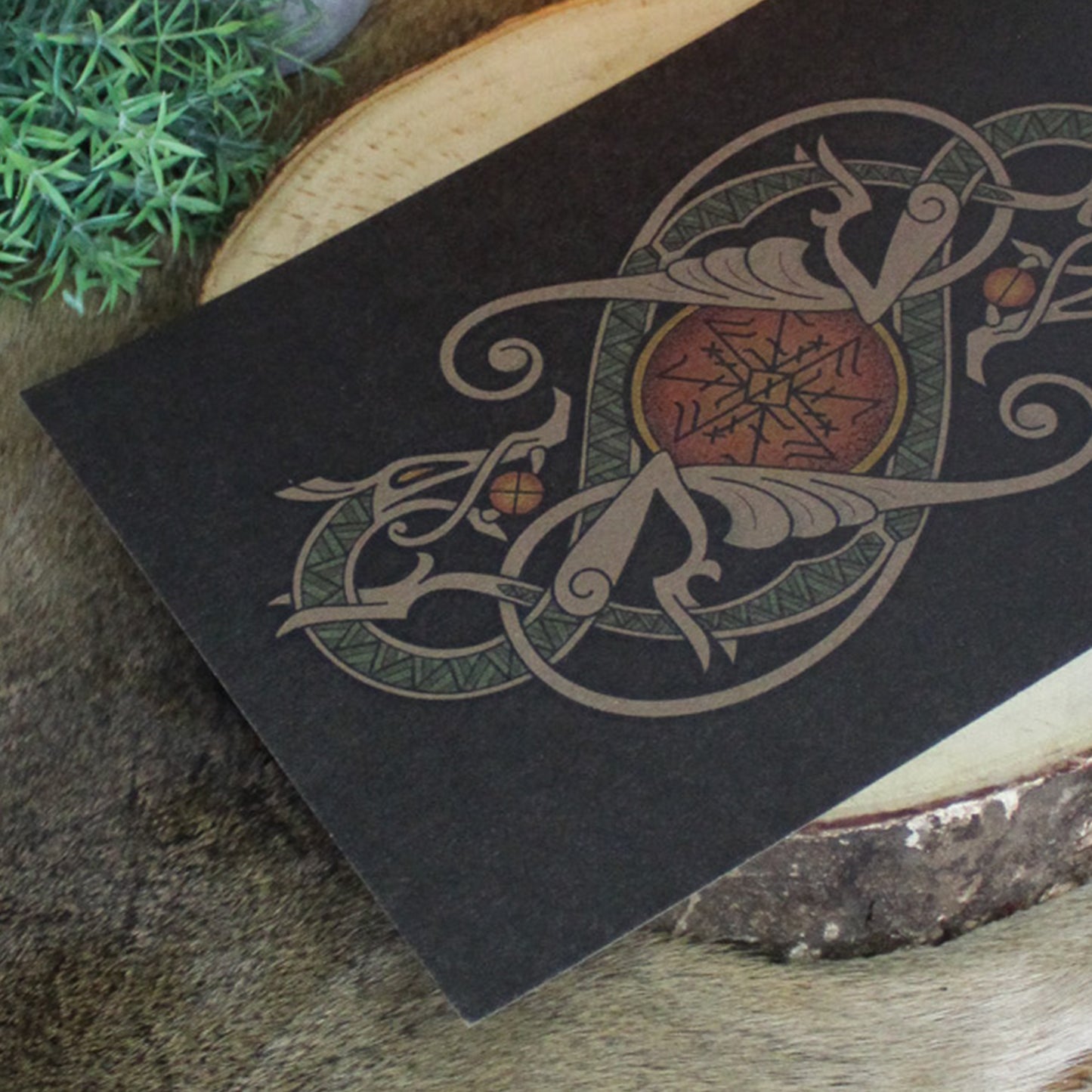 A4 print with a stunning depiction of the celestial wolves, Sköll and Hati, two great figures of Norse myth. This print captures their eternal pursuit in a striking, interwoven traditional Viking knotwork design. Created by Jonas Lau Markussen.