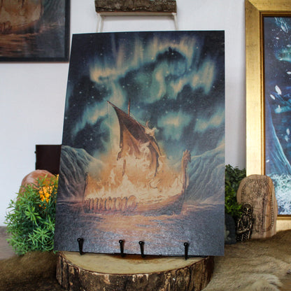 A3 art print of Viking funeral with burning ship on the water inspired by Norse myth, printed on recycled brown paper for a rustic finish.